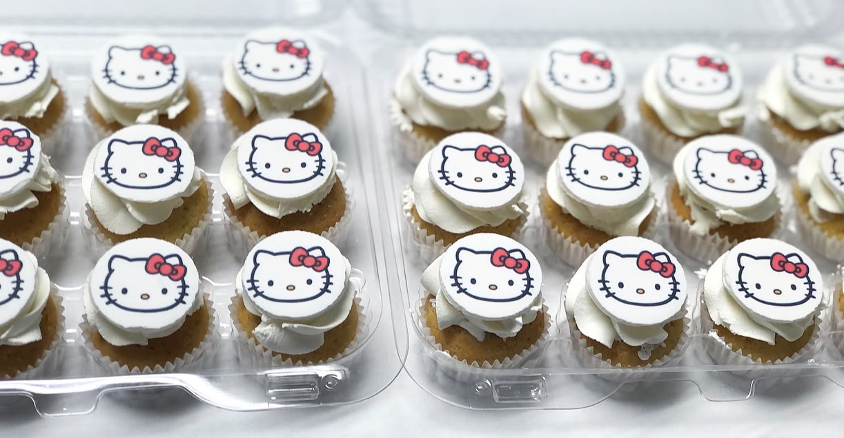 A box of two dozen cupcakes with character edible prints